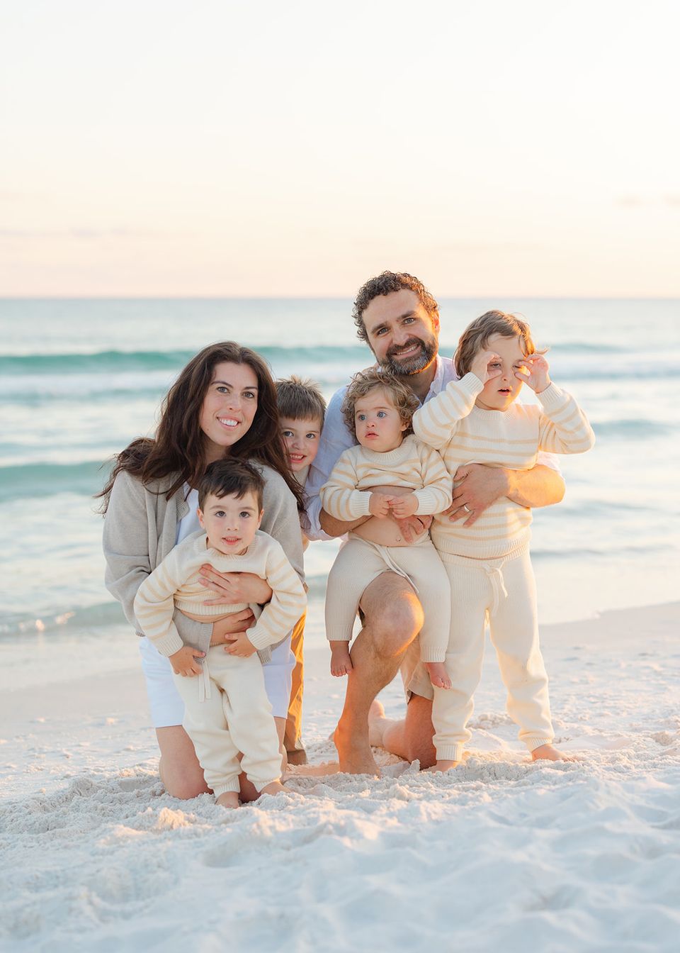 Alex Shoker with his wife, Lauren, and their four children at the beach